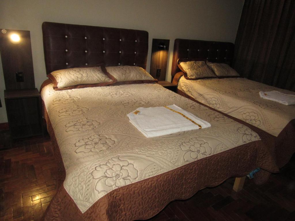 Postel nebo postele na pokoji v ubytování Hotel Sueños Dorados