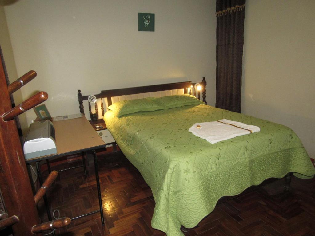 Postel nebo postele na pokoji v ubytování Hotel Sueños Dorados