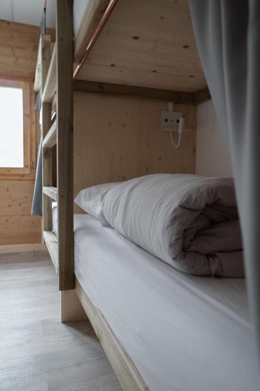 Postel nebo postele na pokoji v ubytování BodyGo Hostel