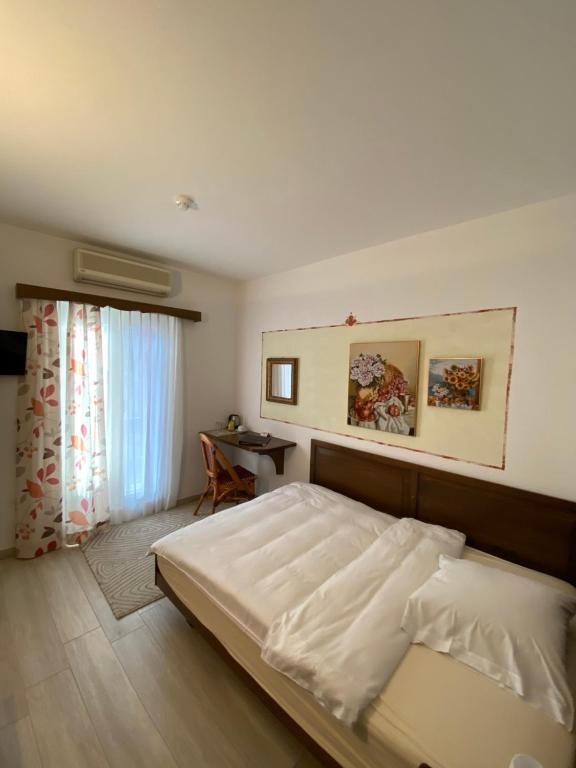 Postel nebo postele na pokoji v ubytování Hotel Antico