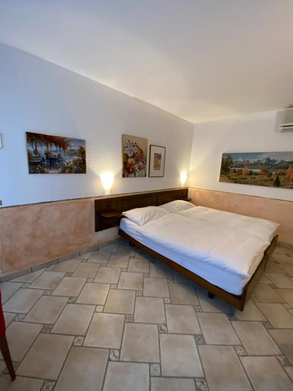 Postel nebo postele na pokoji v ubytování Hotel Antico