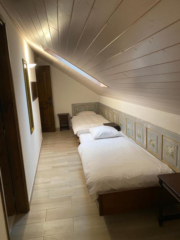 Postel nebo postele na pokoji v ubytování Hotel Antico