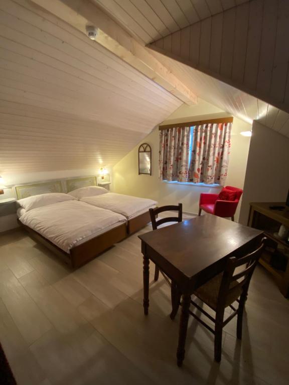 Postel nebo postele na pokoji v ubytování Hotel Antico