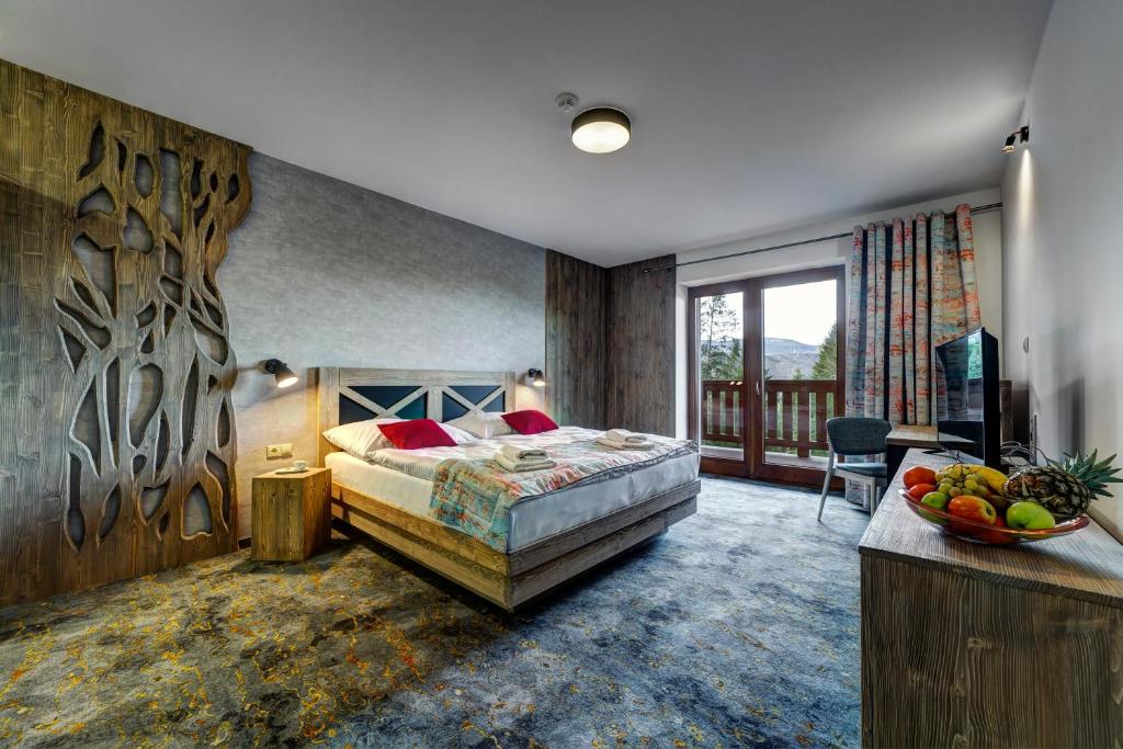 Postel nebo postele na pokoji v ubytování Hotel Strachan Family Jasná