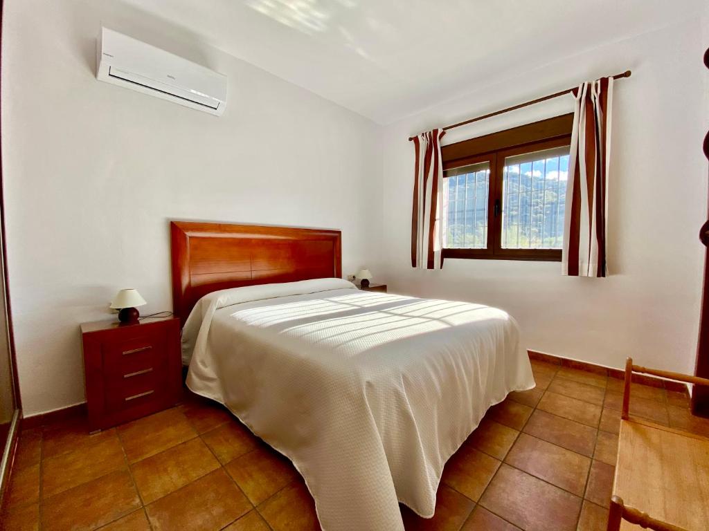 Postel nebo postele na pokoji v ubytování Apartamentos Cedro Alto