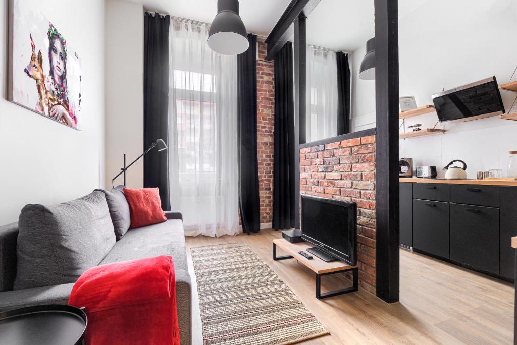 Televízia a/alebo spoločenská miestnosť v ubytovaní MARGI Igram Apartament