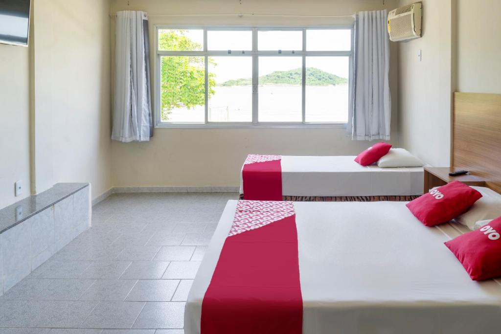 Voodi või voodid majutusasutuse Piúma Palace Hotel toas