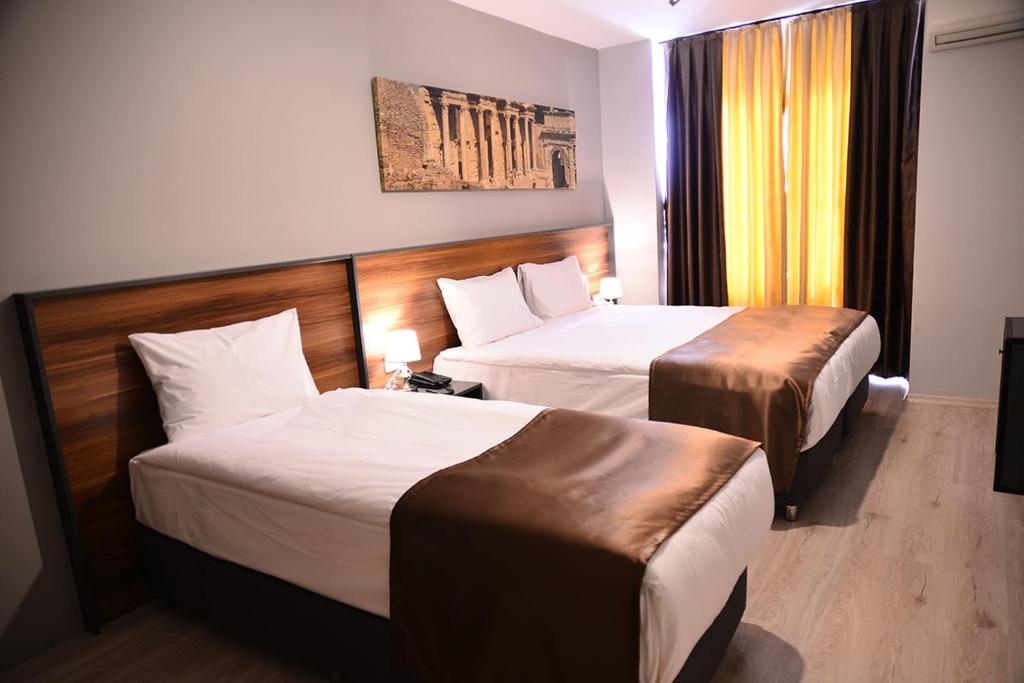 Postel nebo postele na pokoji v ubytování PRIVADO HOTELS