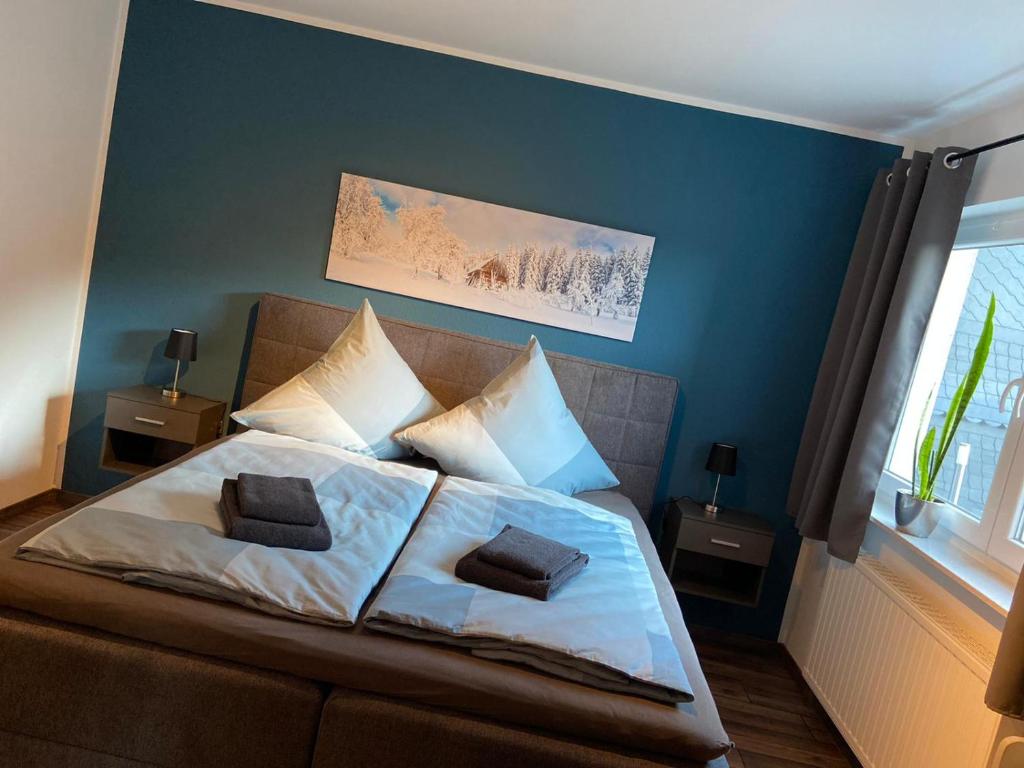 Ένα ή περισσότερα κρεβάτια σε δωμάτιο στο Ferienwohnung "Apartment Sunlife Winterberg" 4 Sterne