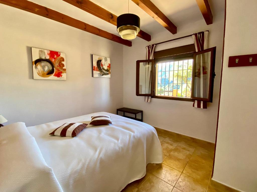 Postel nebo postele na pokoji v ubytování Apartamentos Cedro Alto
