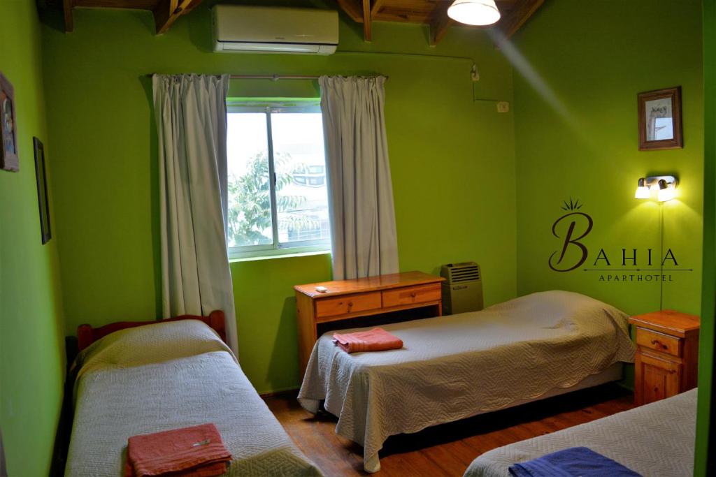 Tempat tidur dalam kamar di ApartHotel Bahia