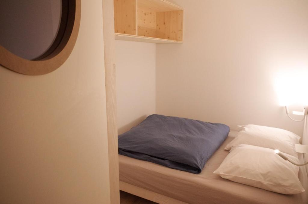 Postel nebo postele na pokoji v ubytování BodyGo Hostel