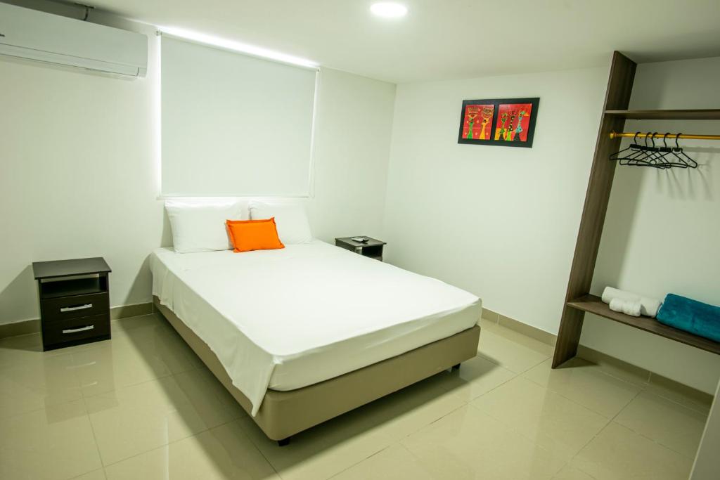 Postel nebo postele na pokoji v ubytování Hotel ITACO