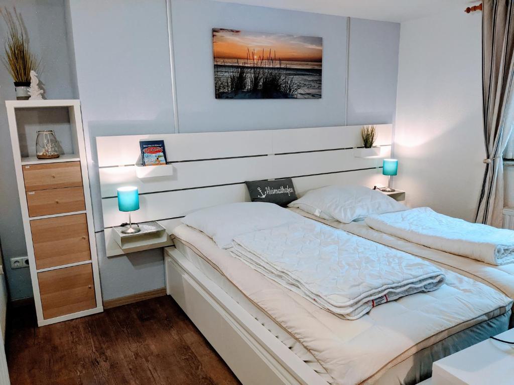 Giường trong phòng chung tại Ferienwohnungen Am Grooten Steen 16