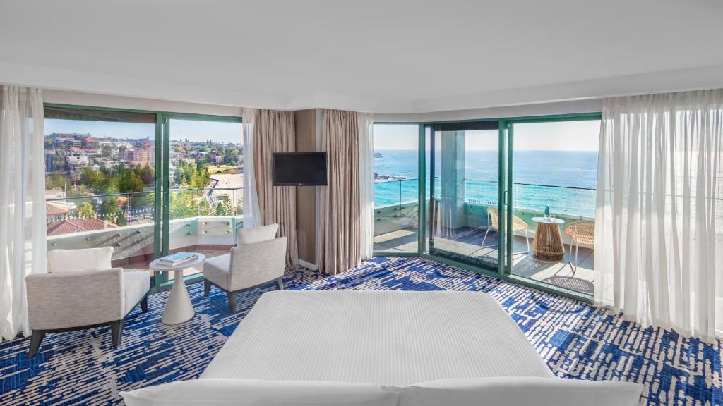 a hotel room with a view of the ocean at Crowne Plaza Sydney Coogee Beach, an IHG Hotel in Sydney