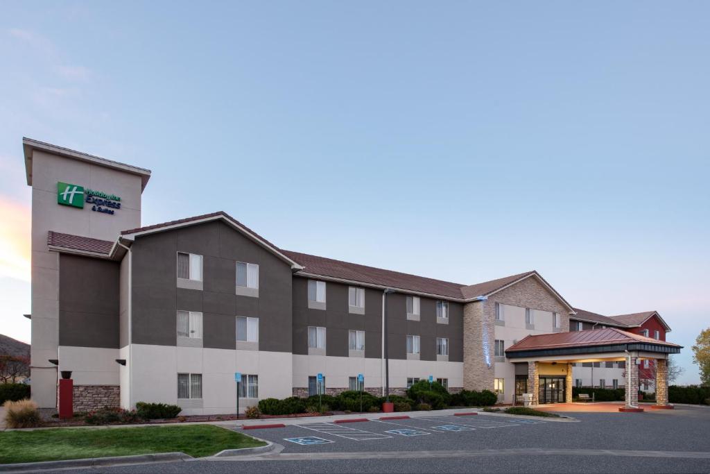 an image of a hotel with a parking lot at Holiday Inn Express Hotel & Suites Littleton, an IHG Hotel in Littleton