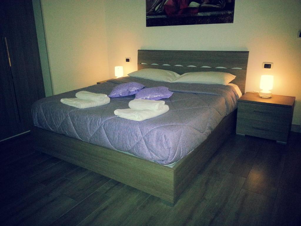 Łóżko lub łóżka w pokoju w obiekcie Appartamento B&B Suite Stefanelli