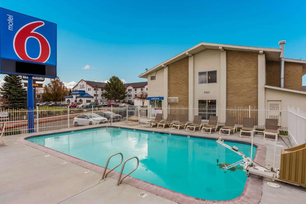 a swimming pool in front of a hotel at Motel 6 Boise - Airport in Boise