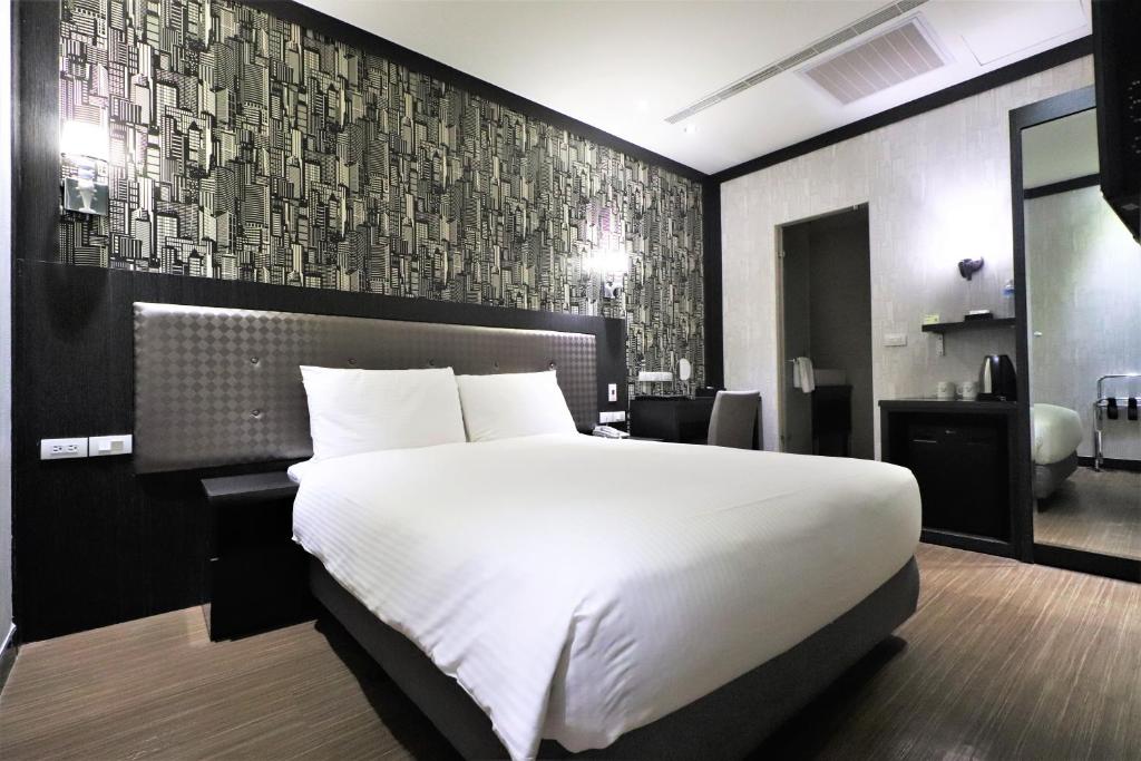 Postel nebo postele na pokoji v ubytování J-HOTEL