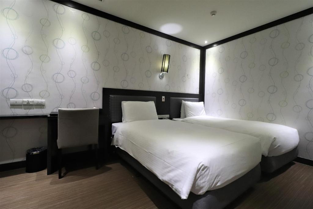 Postel nebo postele na pokoji v ubytování J-HOTEL