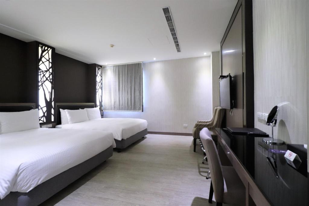 Postel nebo postele na pokoji v ubytování J-HOTEL
