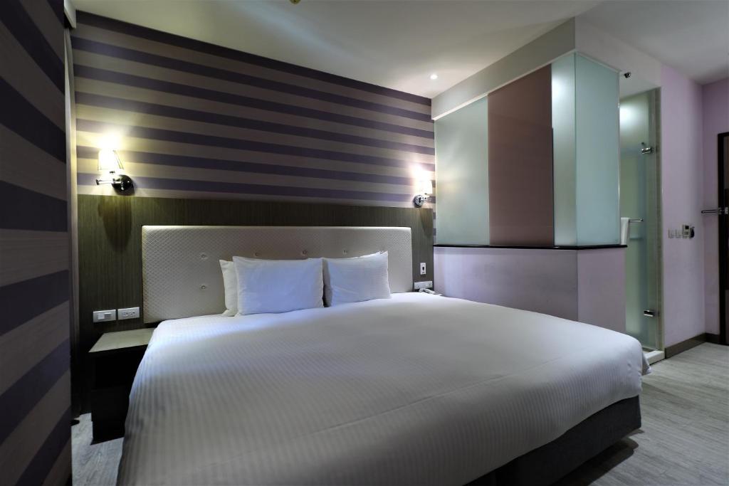 Postel nebo postele na pokoji v ubytování J-HOTEL