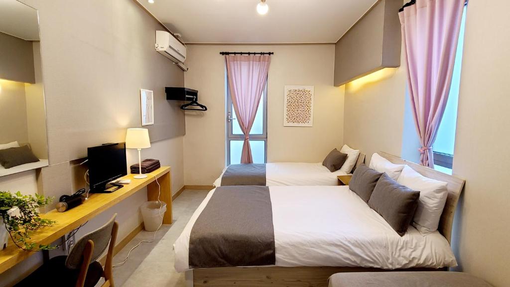 TV a/nebo společenská místnost v ubytování DW Design Residence