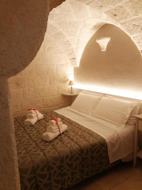 Postel nebo postele na pokoji v ubytování Al Caveau - Holiday House