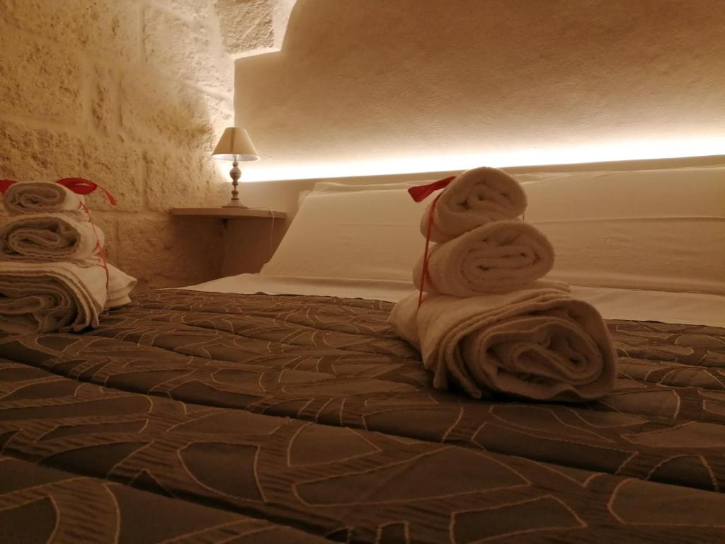 Postel nebo postele na pokoji v ubytování Al Caveau - Holiday House