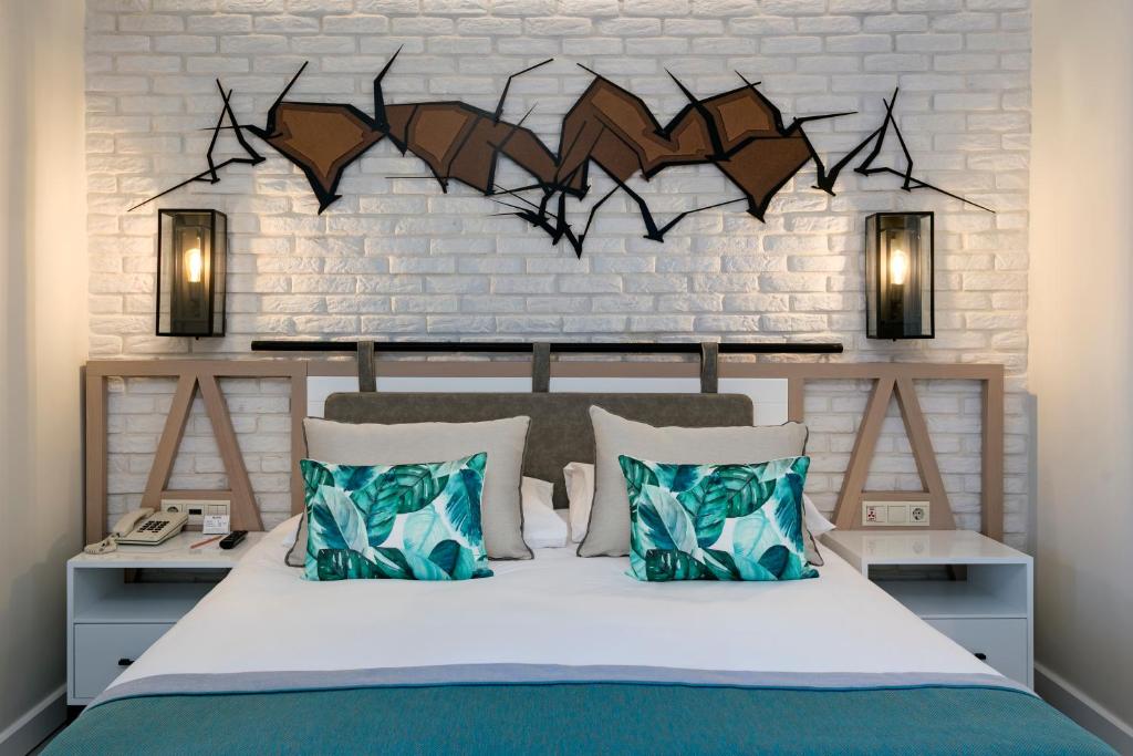 a bedroom with a bed and a wall with bats on it at Limak Arcadia Sport Resort Belek in Belek