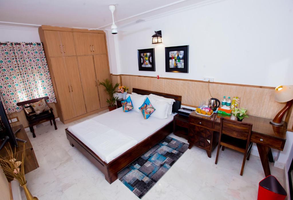 Postel nebo postele na pokoji v ubytování House of Comfort Noida