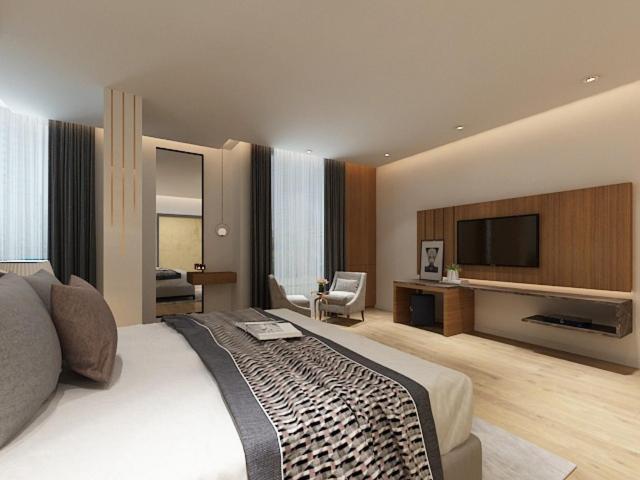 Postel nebo postele na pokoji v ubytování Hotel Bhoomivilas