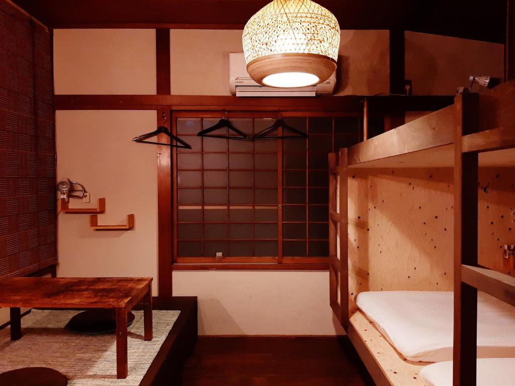 Postel nebo postele na pokoji v ubytování Guest House FUTARENO