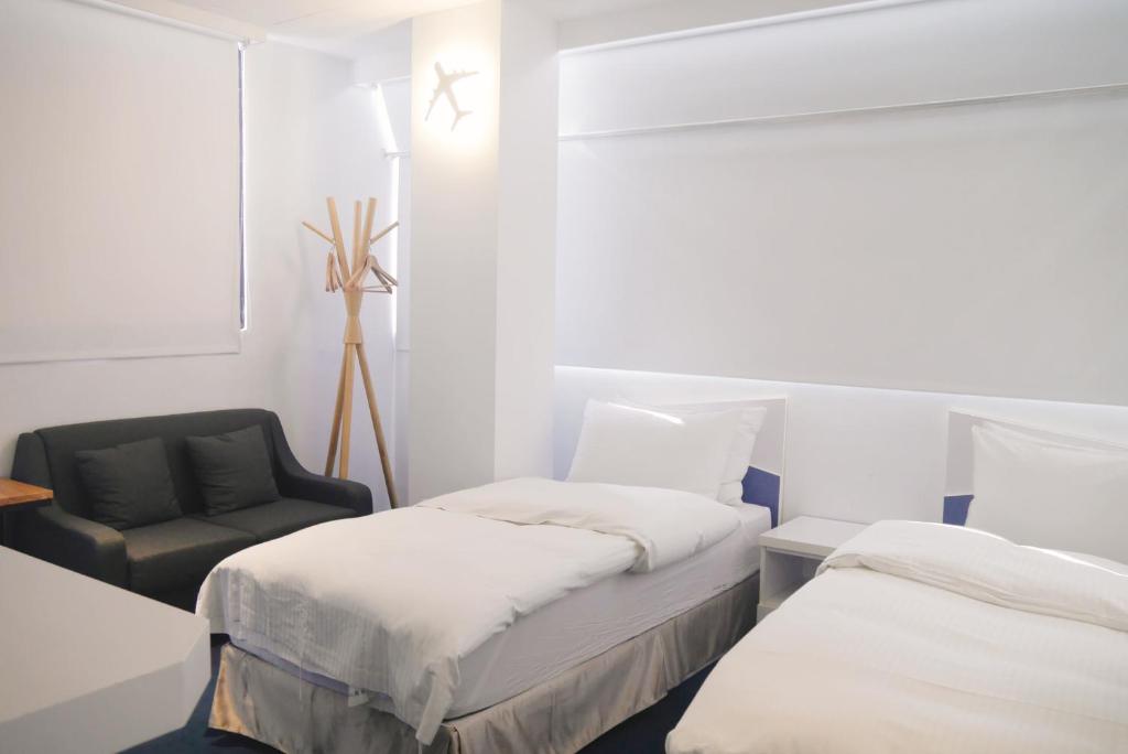 Katil atau katil-katil dalam bilik di Time Flyer Hotel