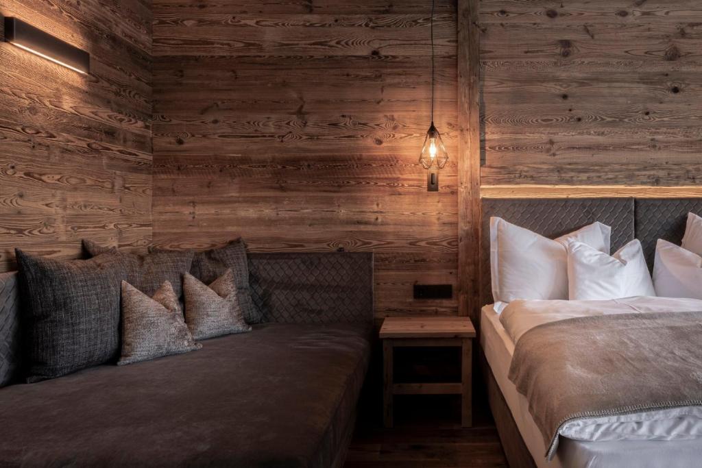 Postel nebo postele na pokoji v ubytování Hotel Niblea Dolomites