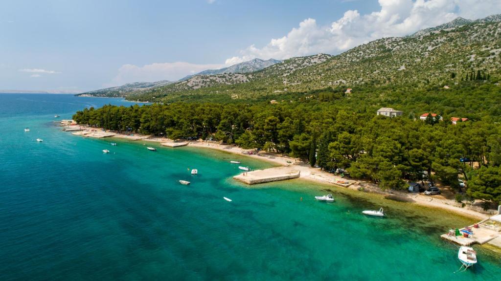 an aerial view of a beach with boats in the water at Camp Sibuljina in Šibuljina