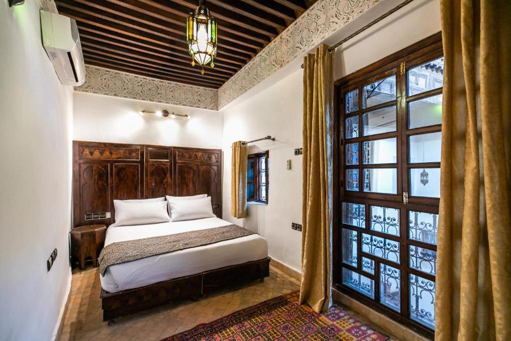 Postel nebo postele na pokoji v ubytování Riad Fes Aicha