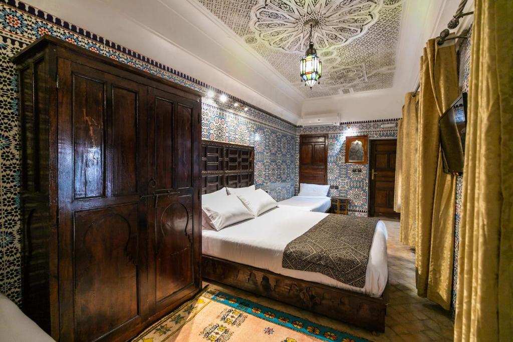 Postel nebo postele na pokoji v ubytování Riad Fes Aicha