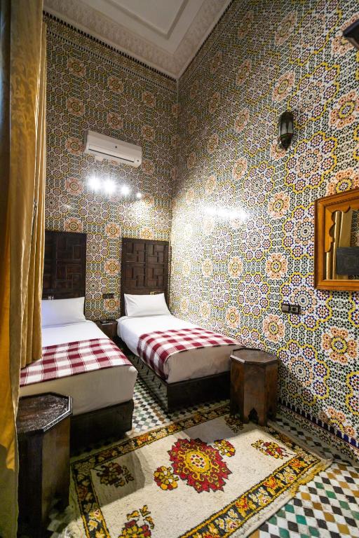 Postel nebo postele na pokoji v ubytování Riad Fes Aicha
