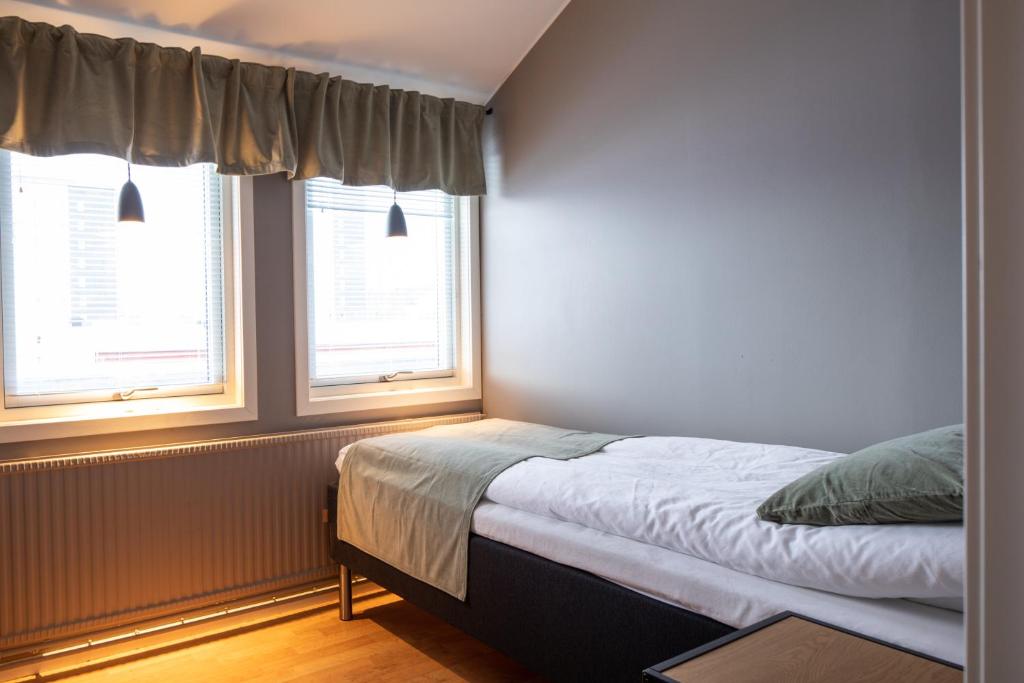 Postel nebo postele na pokoji v ubytování Hotel B&B Gränden