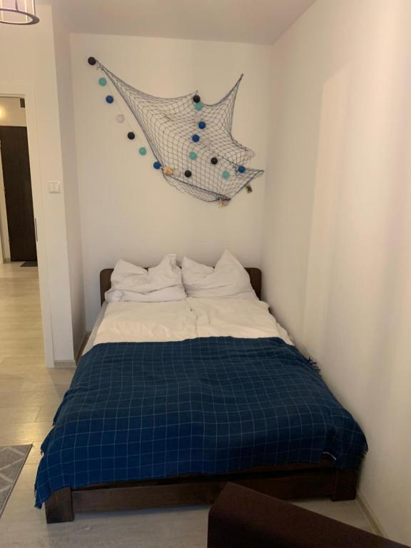 Posteľ alebo postele v izbe v ubytovaní Apartament Admiralski