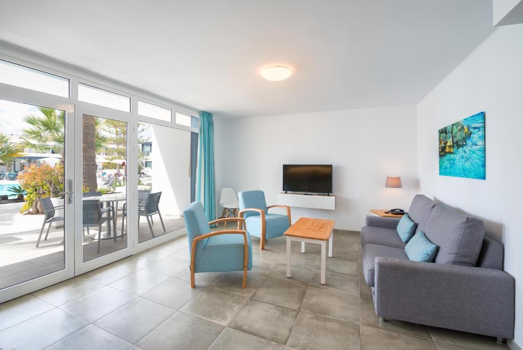 TV a/nebo společenská místnost v ubytování Apartamentos Playamar