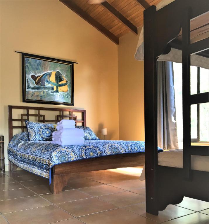 Postel nebo postele na pokoji v ubytování Mango Tree Villas
