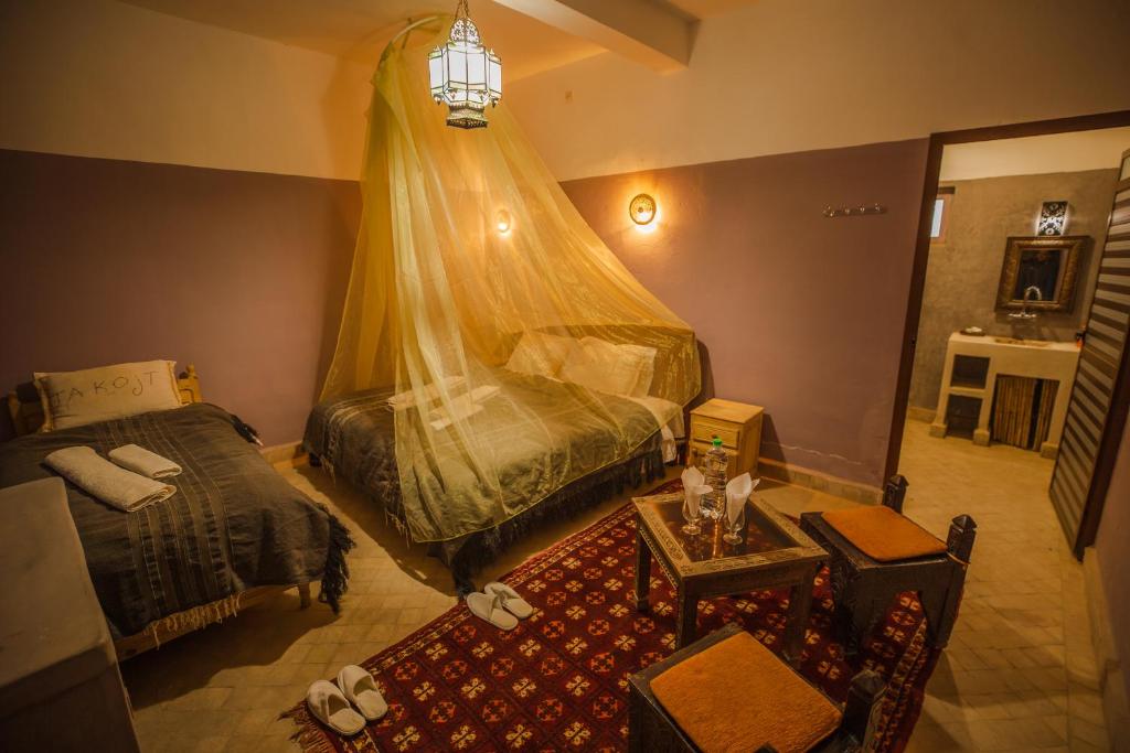 Postel nebo postele na pokoji v ubytování Takojt