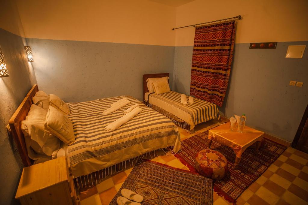 Postel nebo postele na pokoji v ubytování Takojt