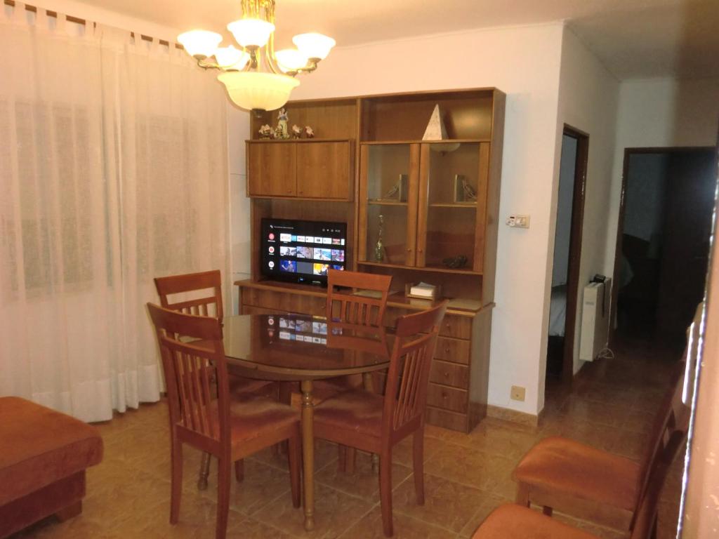 a dining room with a table and chairs at Piso Zafer Alcora in Alcora