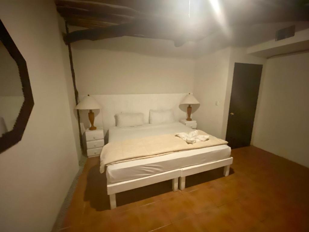Postel nebo postele na pokoji v ubytování Casa CARIBE Cancun