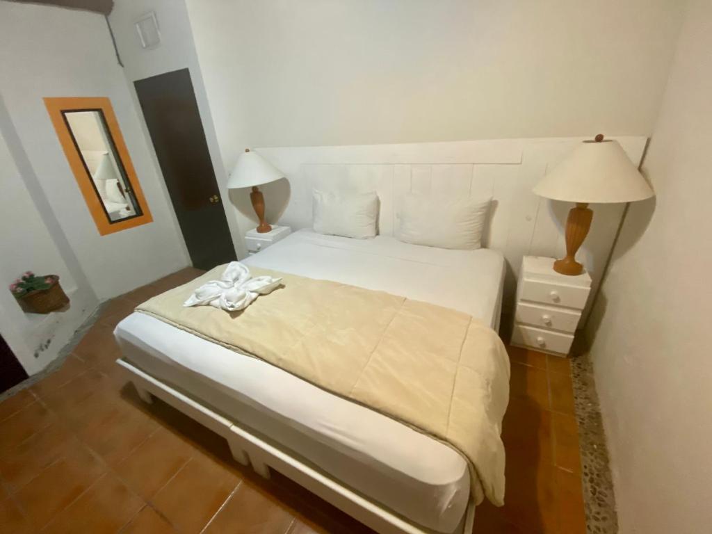 Postel nebo postele na pokoji v ubytování Casa CARIBE Cancun