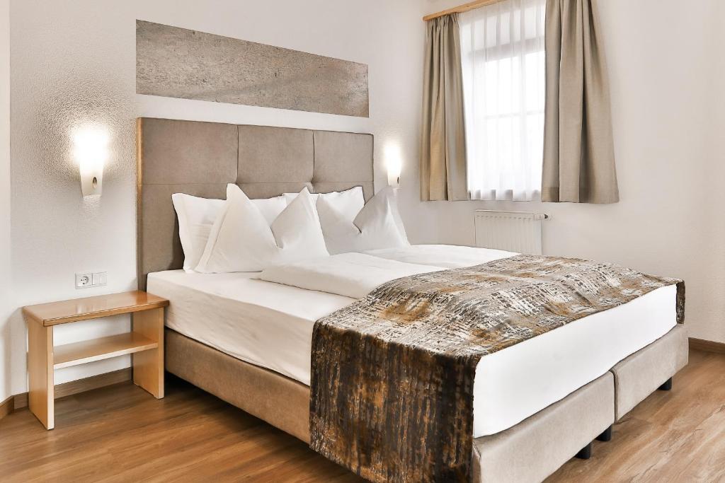 Łóżko lub łóżka w pokoju w obiekcie Residence Kronenwirt