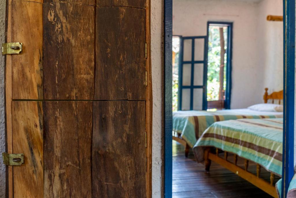 Postel nebo postele na pokoji v ubytování Hotel Casa de Nelly